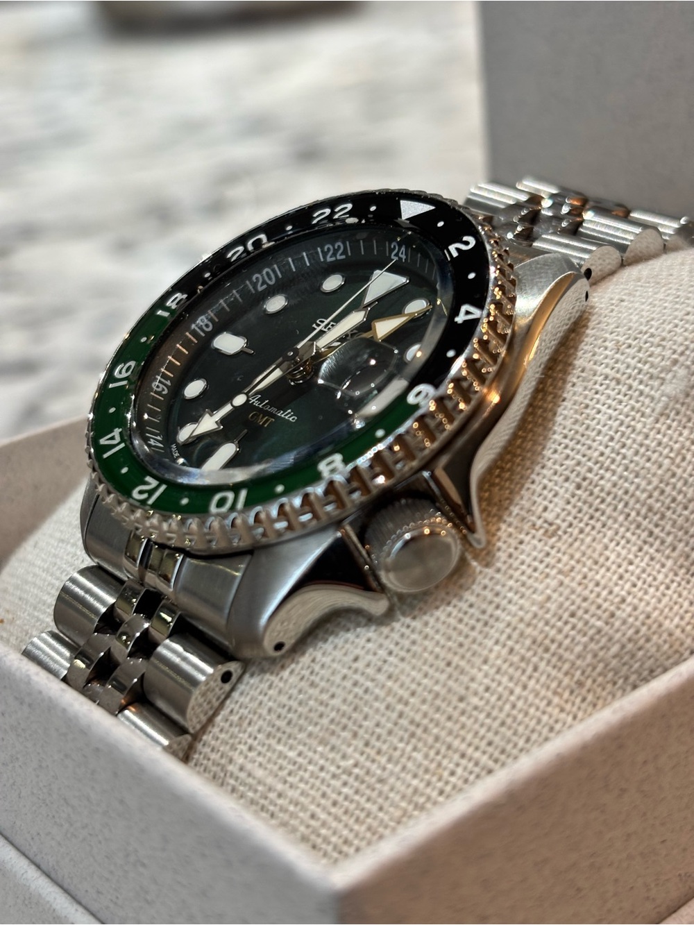 Seiko Stainless Steel Watch with Black and Green Bezel
